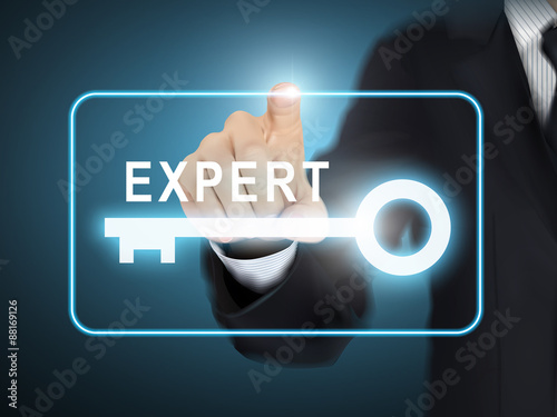 male hand pressing expert key button