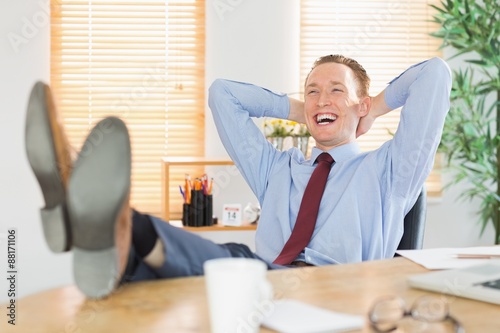 Relaxed businessman with his feet up