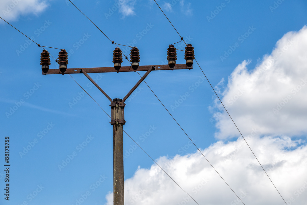 Powerlines against a background of the sky