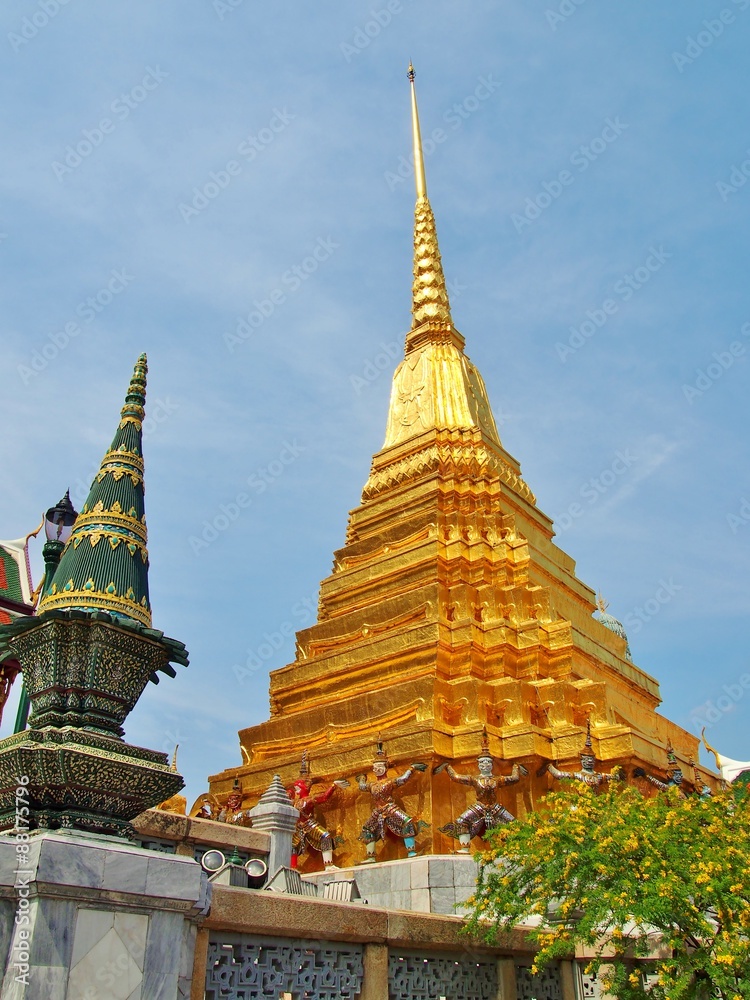 Fototapeta premium Golden pagoda in Temple of Emerald Buddha (Wat Phra Kaew) at Grand Palace in Bangkok Thailand.
