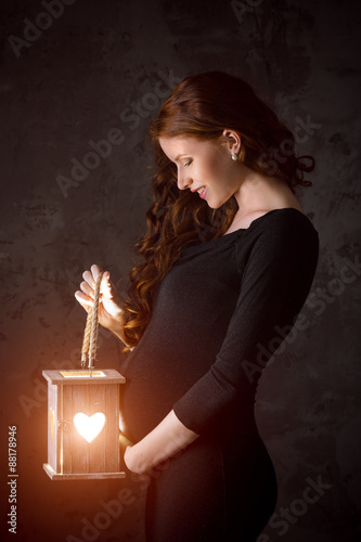 Beautiful pregnant woman enjoys new life