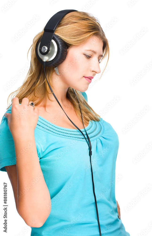 Beautiful girl with headphones isolated on white. Beautiful girl with headphones isolated on white.