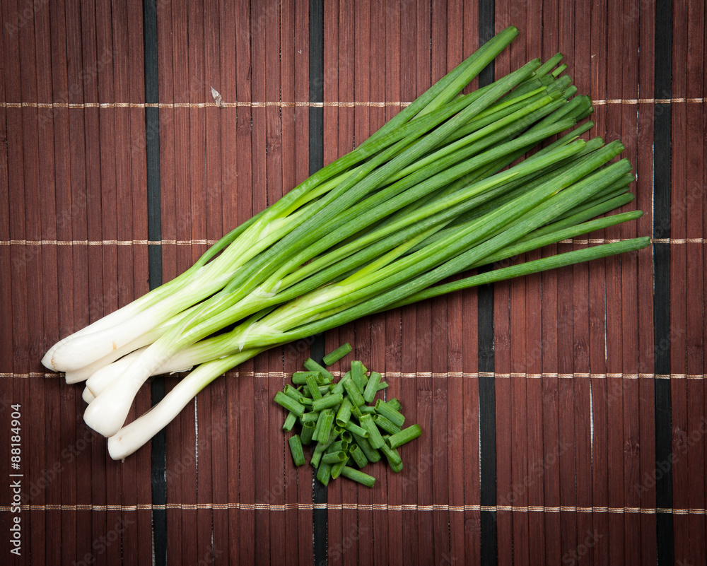 Chopped green onions on a wooden Chopped green onions on a wooden