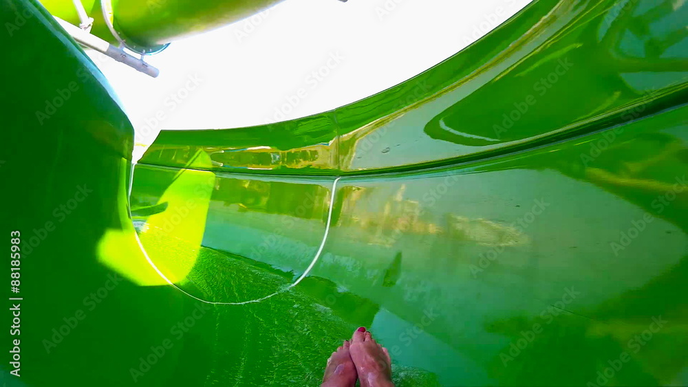 Green water slide at the aqua park Stock Video | Adobe Stock