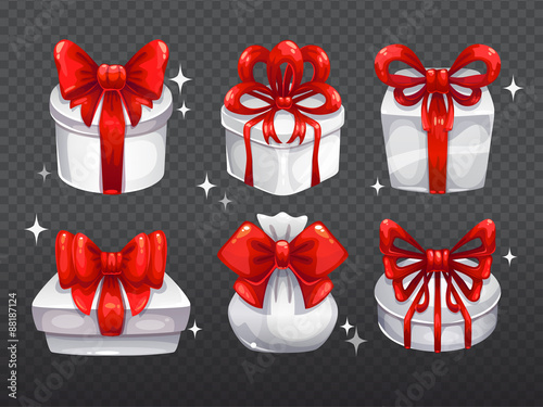 White gift boxes with big red bows