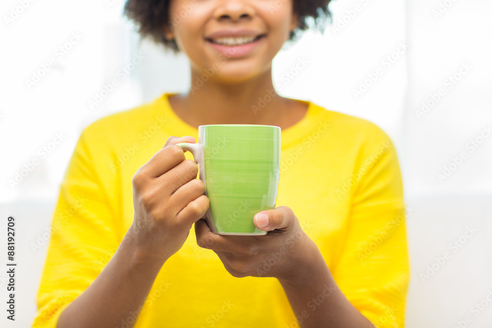 happy african american woman drinking from tea cup happy african american woman drinking from tea cup