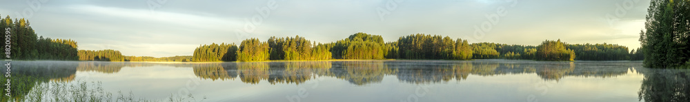 panorama view of the calm lake shore in Europe with fog, reflection of trees and greenery at dawn - obrazy, fototapety, plakaty 