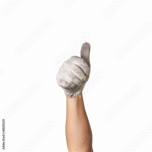 hand in  dirty work gloves with thumb up isolated on white backg