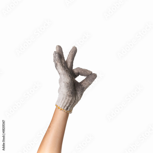 hand in  dirty work gloves with thumb up isolated on white backg