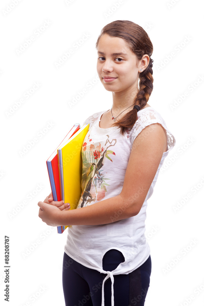 Cute teen girl holding notebooks on white background Cute teen girl holding notebooks on white background
