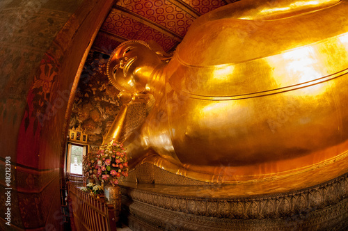 The Reclining Buddha inside one of the most famous temples called Wat Pho in Bangkok, Thailand