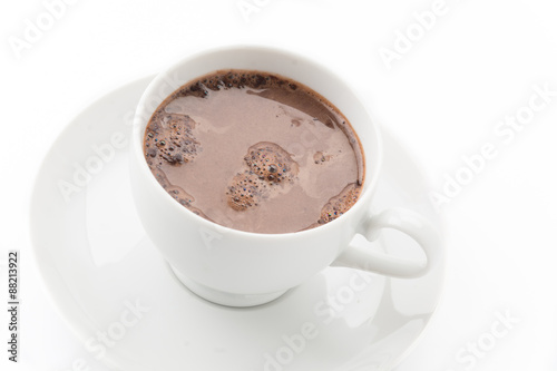 a cup of chocolate on white