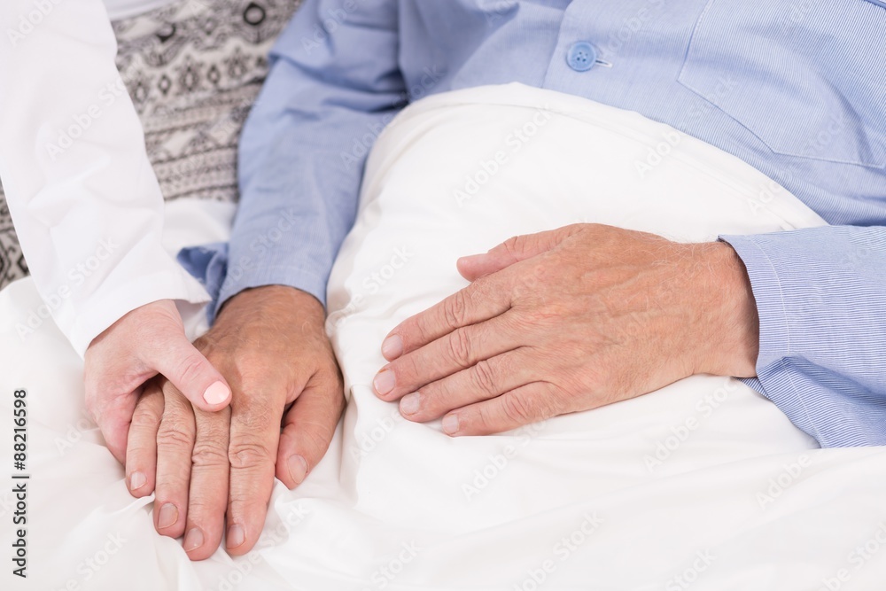 Nurse supporting old male patient Nurse supporting old male patient