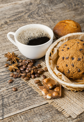 coffee and cookies on wood background