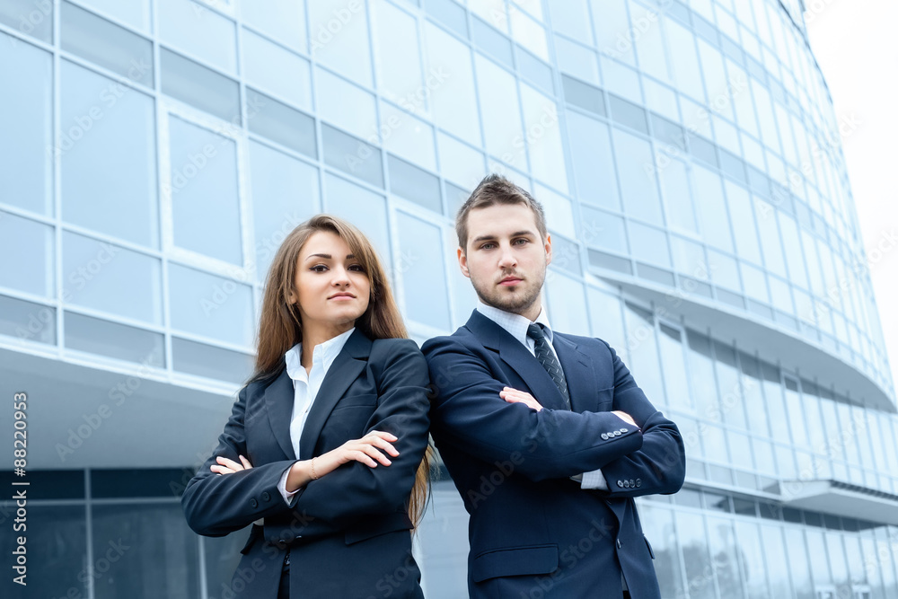 Business partners discussing documents and ideas, standing in front of his office. Business partners discussing documents and ideas, standing in front of his office.