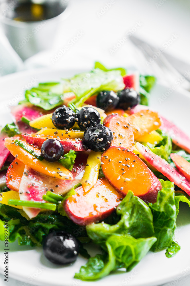 Summer salad with vegetables and berries