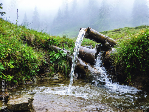 Tableau sur toile Carpathians, source of spring water, near mount Petros