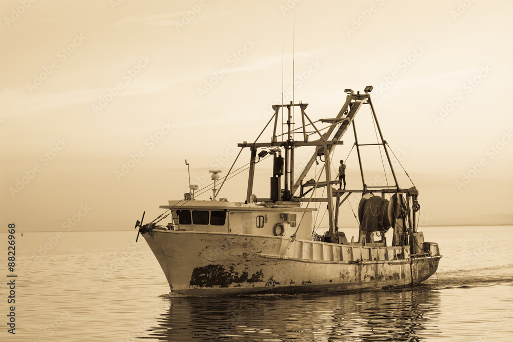 Fishing boat off coast of Florida.  Vintage artistic filters applied. 