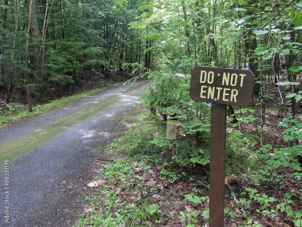 Do Not Enter Sign on forest road Do Not Enter Sign on forest road