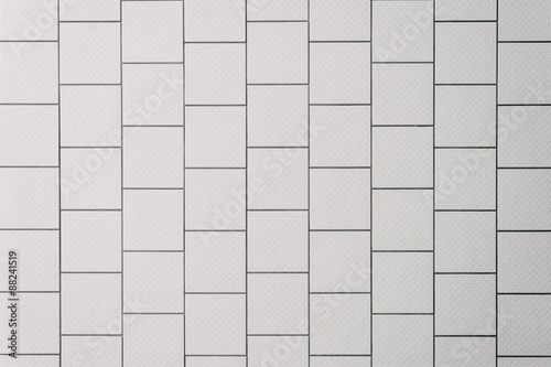 background of a tiled wall, white tiles with black grout