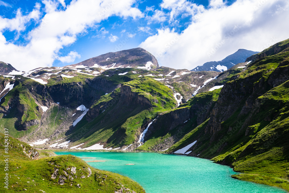 beautiful turquoise lake below the high mountains
