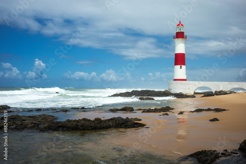 Brazil, Salvador, the Farol De Itapua (lighthouse) on the rough sea