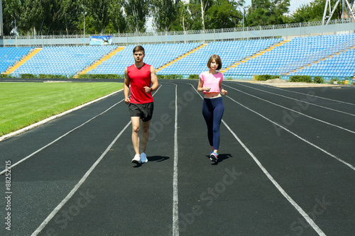 Young people jogging on stadium