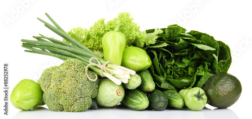 Heap of green vegetables isolated on white
