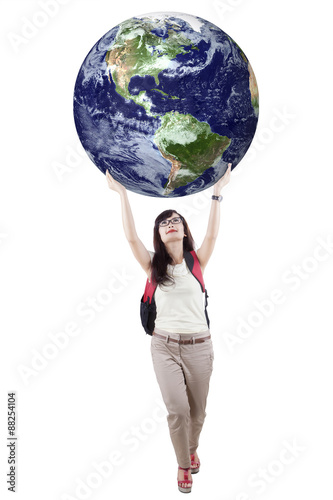 Casual student is holding globe 1