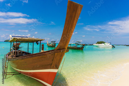 Longtail wood boat and islands in andaman sea © themorningglory