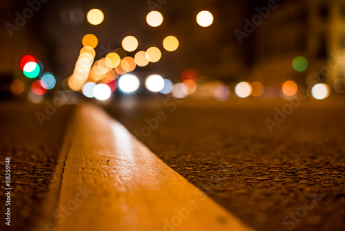 Nights lights of the big city, the night avenue with road markin photo