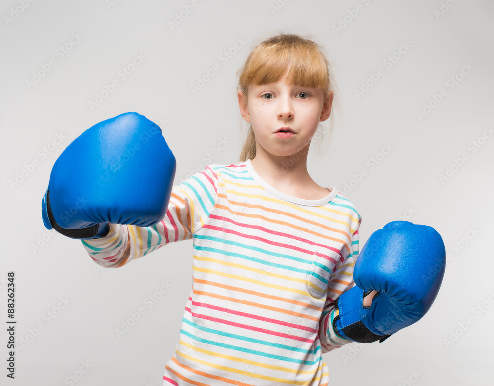 Little girl with boxing gloves