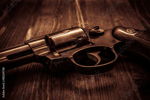 Revolver on the wooden table