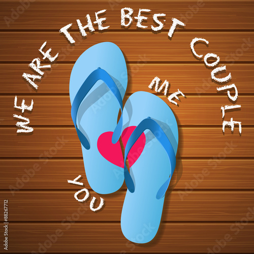 a pair of rubber flipflops on a wood panel