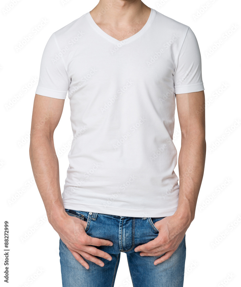 Young man in a white V shape t-shirt, hands in pockets. Isolated. foto de  Stock | Adobe Stock