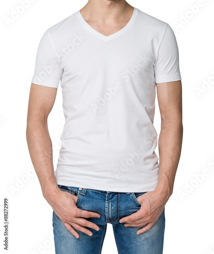 Young man in a white V shape t-shirt, hands in pockets. Isolated.