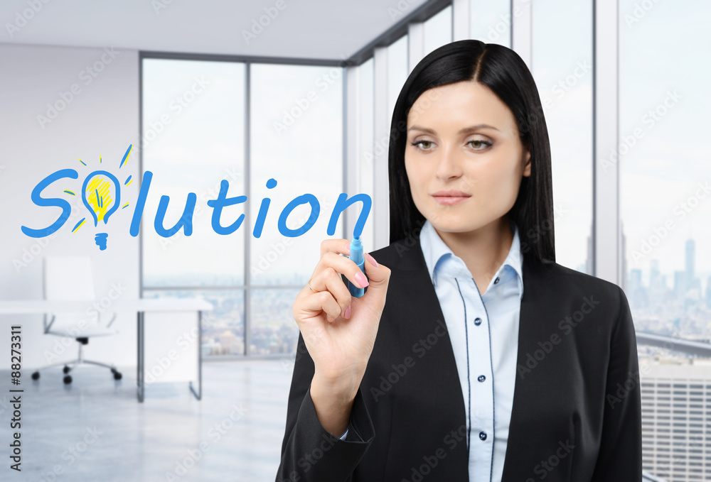 Brunette businesswoman is writing a word ' solution ' on the glass screen. Modern office with New York panorama. Brunette businesswoman is writing a word ' solution ' on the glass screen. Modern office with New York panorama.