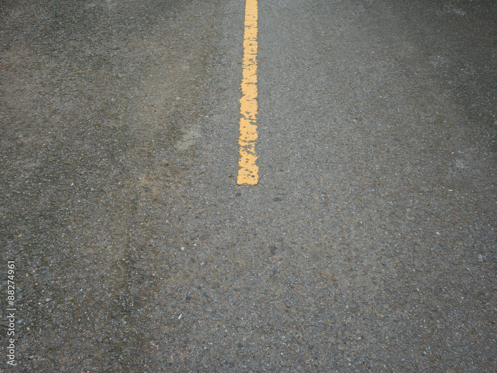 Rugged street with yellow center line. Rugged street with yellow center line.