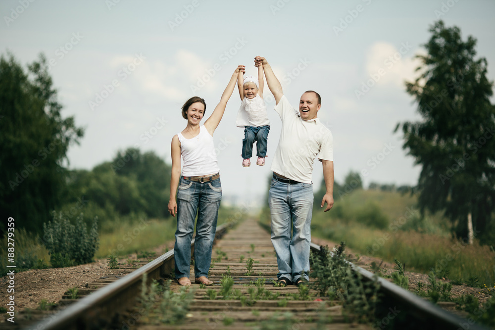 parents with baby on railroad parents with baby on railroad
