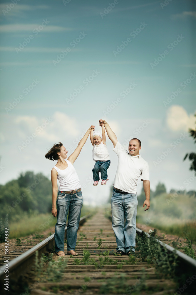 parents with baby on railroad parents with baby on railroad