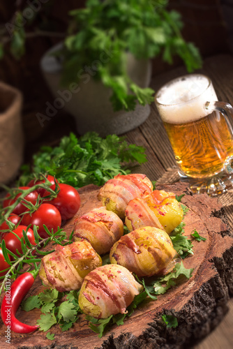 Fototapeta Naklejka Na Ścianę i Meble -  Baked potatoes wrapped in ham
