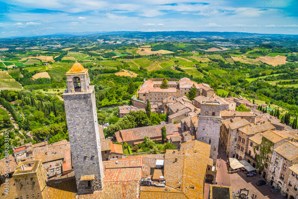 Medieval town of San Gimignano with Tuscan countryside on a sunny day, Tuscany, Italy