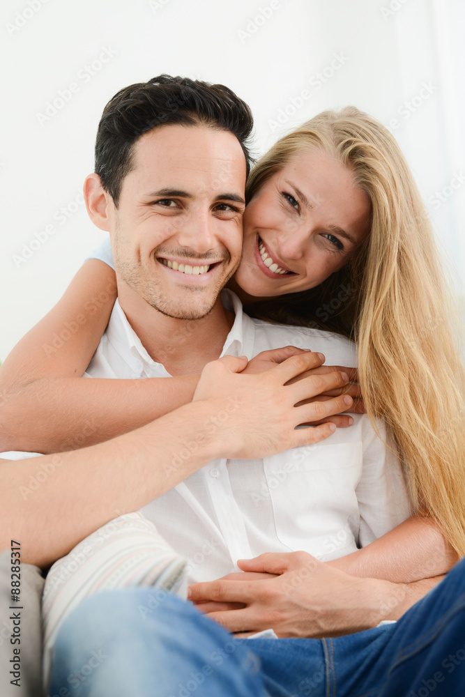 beautiful and happy young couple in love relaxed at home