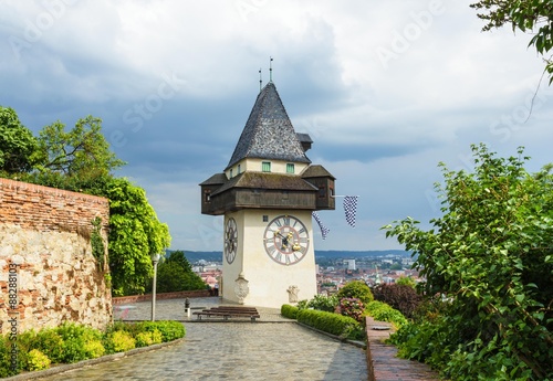 Uhrturm, Clock tower of Graz in spring on rainy and cloudy day, Austria.