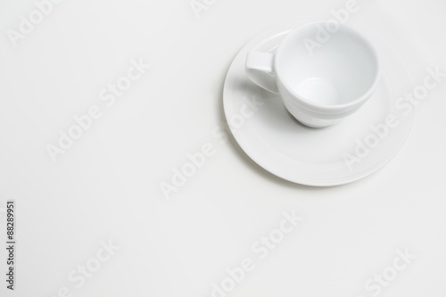 White empty coffee cup on white background. View top