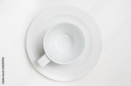 White empty coffee cup on white background. View top