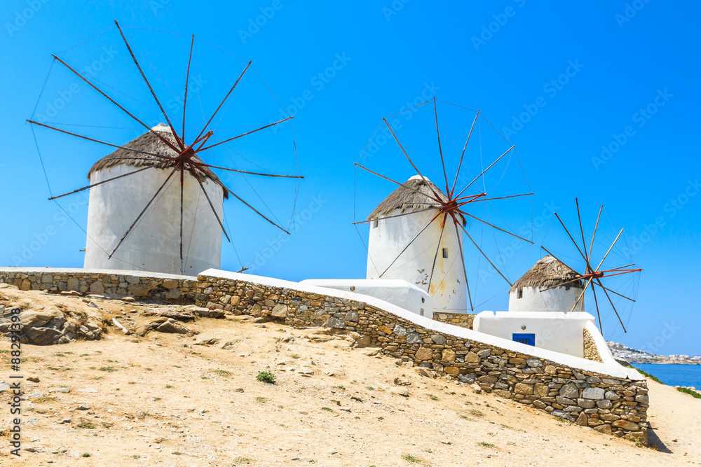 Scenic view of traditional greek windmills on Mykonos island at sunrise, Cyclades, Greece