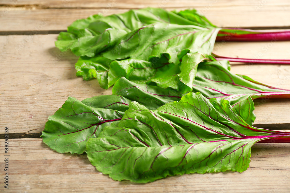 Fresh swiss chard on wooden table, close up Fresh swiss chard on wooden table, close up