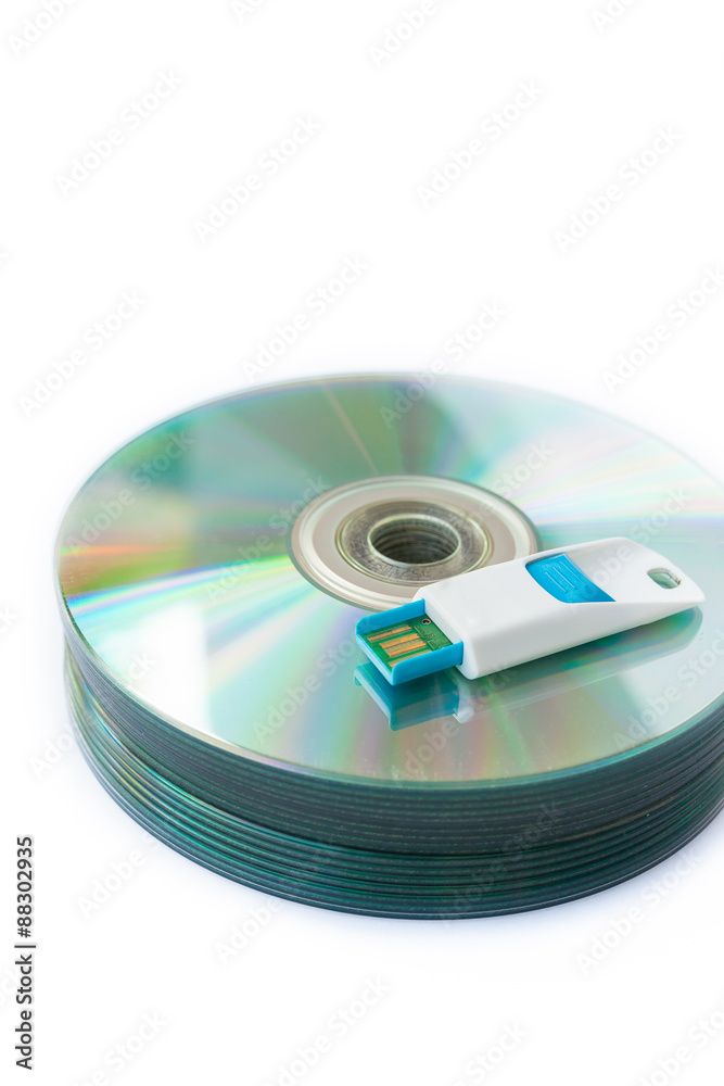 Usb flash drives on stacked CDs isolate on white background. Usb flash drives on stacked CDs isolate on white background.