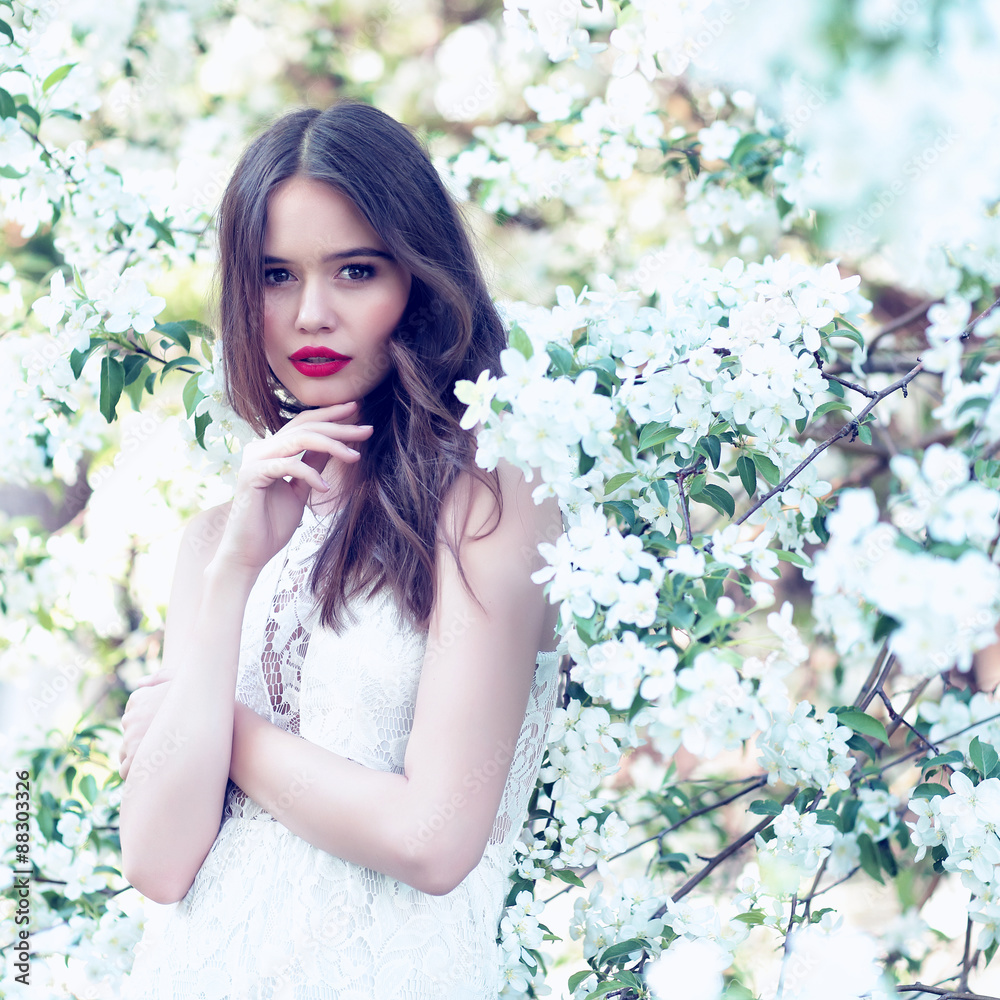 Portrait of young beautiful woman in spring blossom trees. Portrait of young beautiful woman in spring blossom trees.
